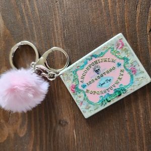 Ladies ouija board with pom pom keychain